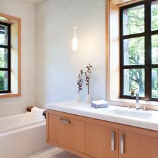 Crisp, Clean Guest Bath Features Natural Stone & Floating Vanity