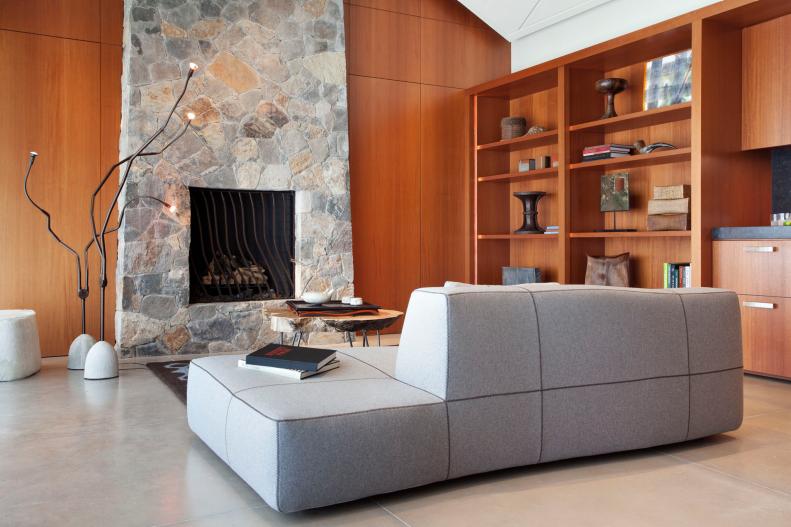 Brown Wood Contemporary Living Room With Fireplace & Built-In Bookcase