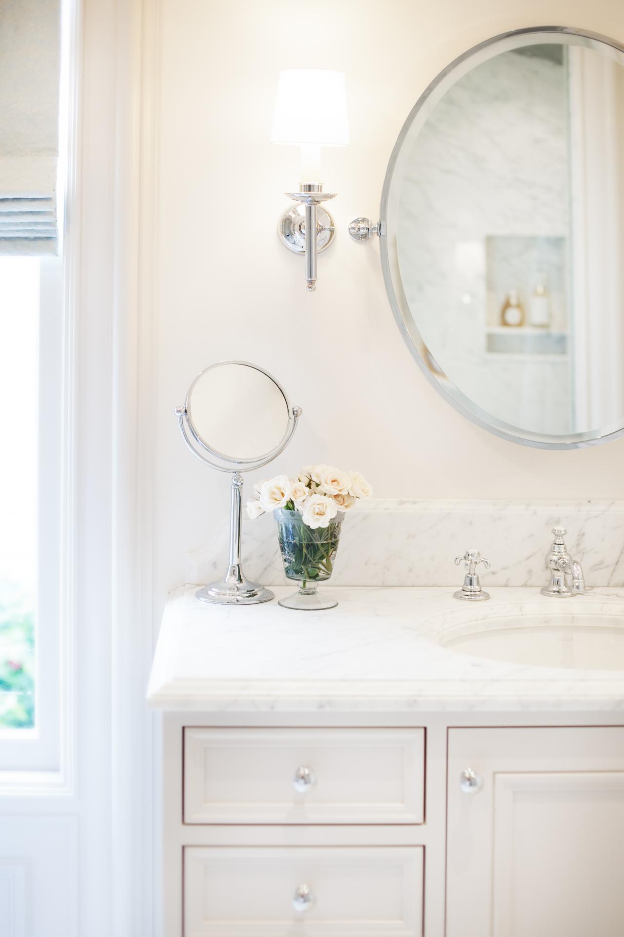 white bathroom cabinets with dark countertops