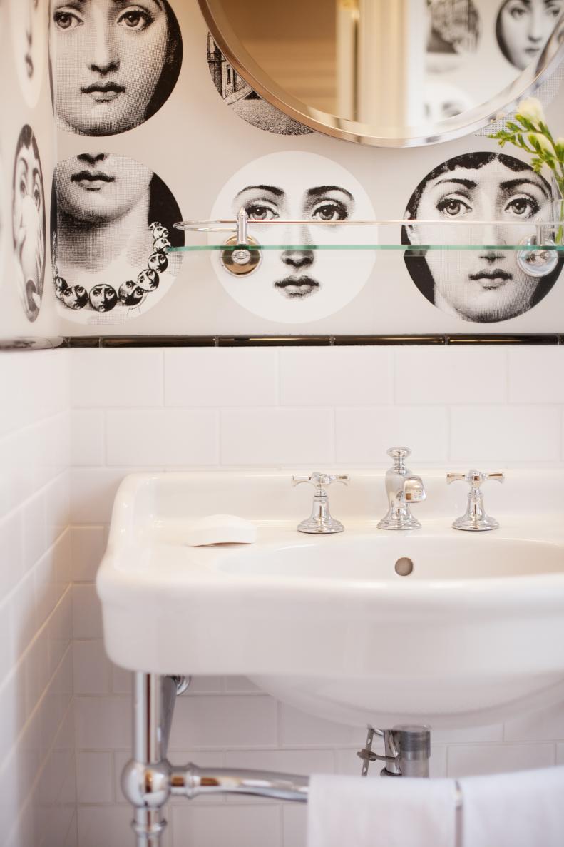 White Bathroom Sink and Black & White Face Wallpaper