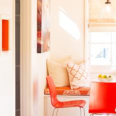 Stylish, Remodeled Kitchen Features Orange Banquette and Chairs