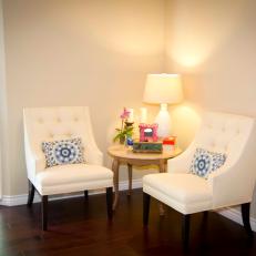 Neutral Seating Nook With White Armchairs