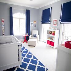 Blue and White Transitional Nursery With Red Accents