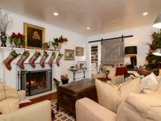 Country Living Room With Plaid Stockings Hung on Mantel