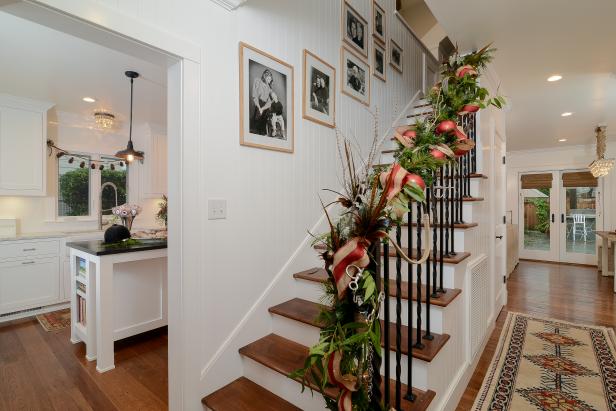 White Staircase With Holiday Garland on Banister