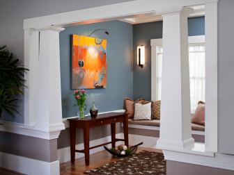 Blue Foyer With White Columns, Inset Hardwood Floors