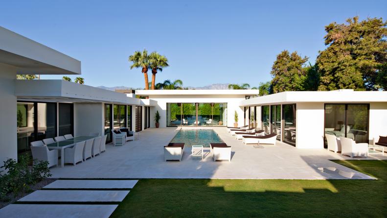 Modern Backyard With Pool and White Outdoor Furniture