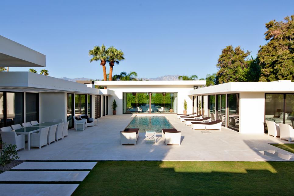 Modern Backyard With Pool and White Outdoor Furniture