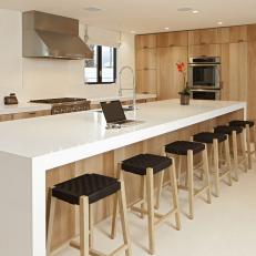 Modern Kitchen Boasts White Island With Waterfall Countertop