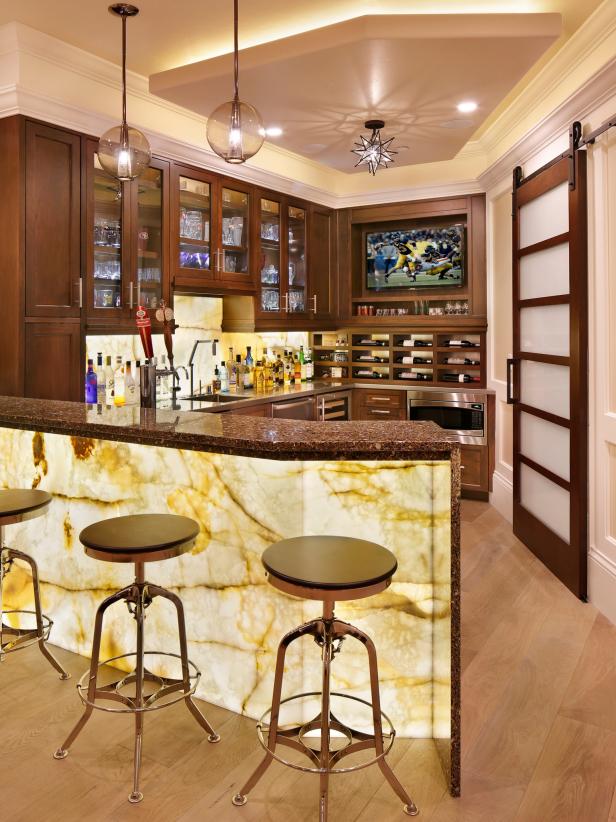 Bar With Traditional Wood Cabinets and Built-In TV