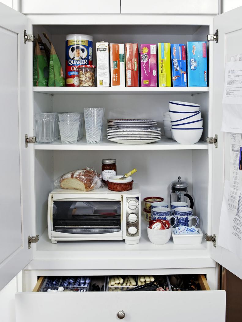 White Cabinet with Breakfast Dishes and Foods