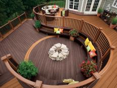 Brown Two-Tier Curved Deck With Bench Seating and Fire Pit