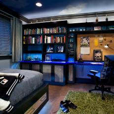 Boy's Blue Baseball-Themed Bedroom With Bookshelves