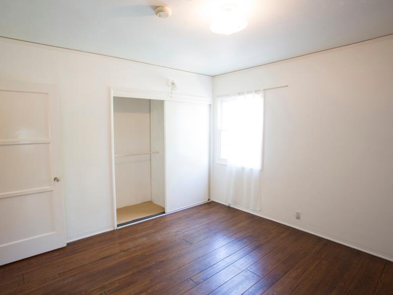 Empty White Bedroom With Shallow Closet, Hardwood Floors
