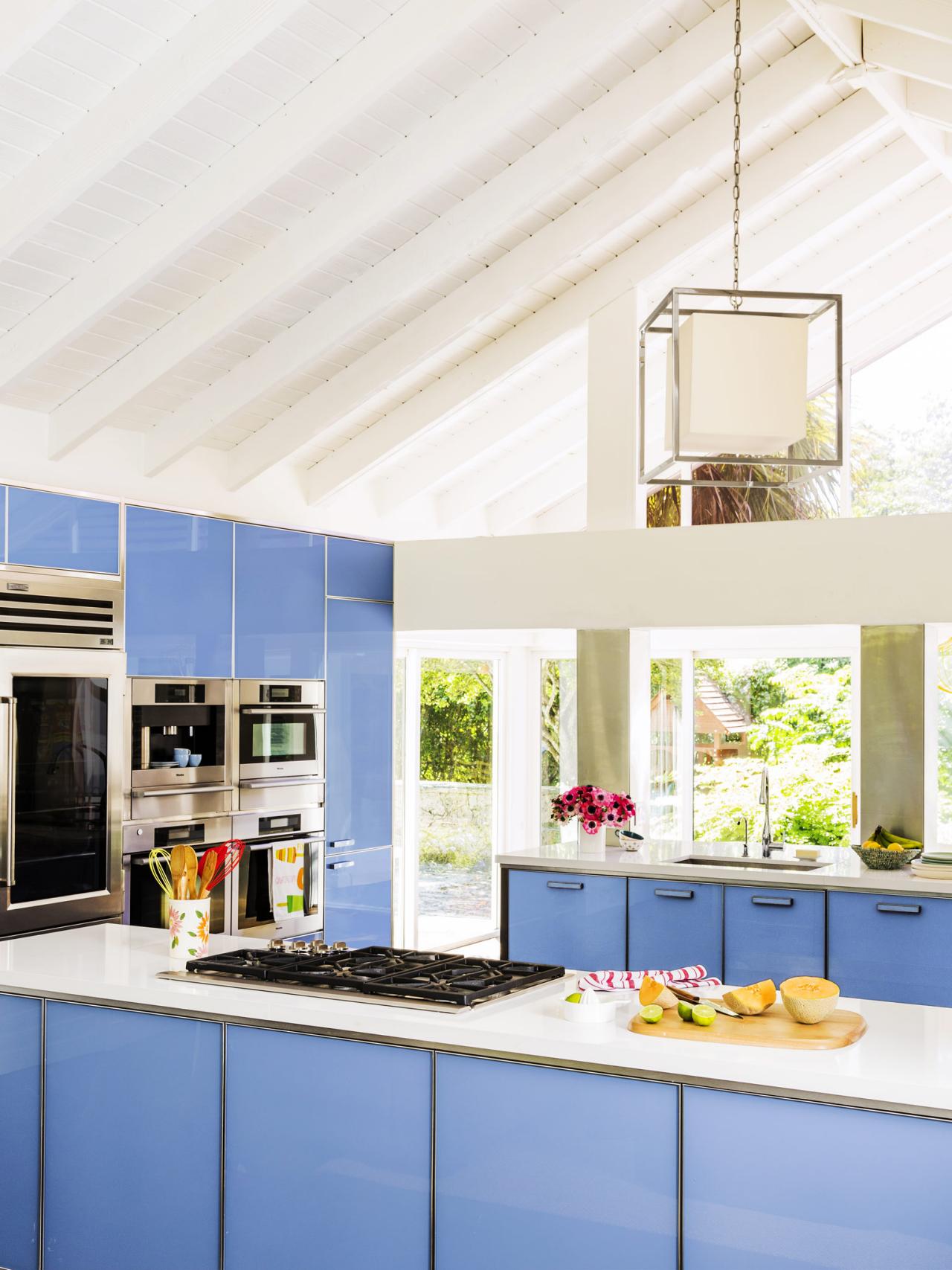 Modern Kitchen With High Ceilings And Blue Glass Cabinets Hgtv