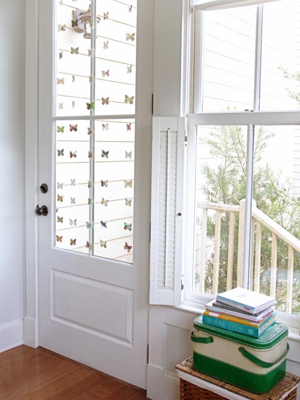 Bring the outdoors in with a colorful, spring-inspired window garland. This super easy project, made with a butterfly punch, old magazine pages and fishing line. It looks great no matter which side of the window you're looking through.