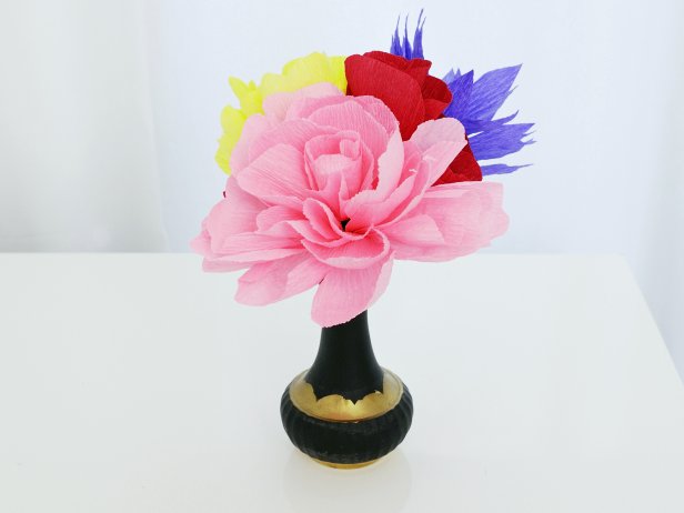 Display the paper flowers in vases together or separately.