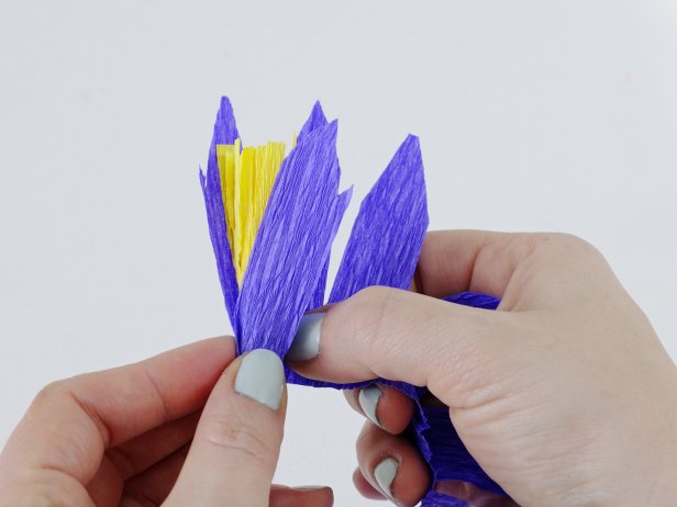 Wrap the petals around the stamen, crimping and pleating as you go.