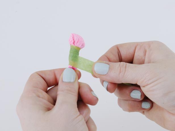 Stretch the crepe paper over the cotton ball, and secure to the wire with floral tape. Keep stretching and wrapping to create a seamless look with the wire.
