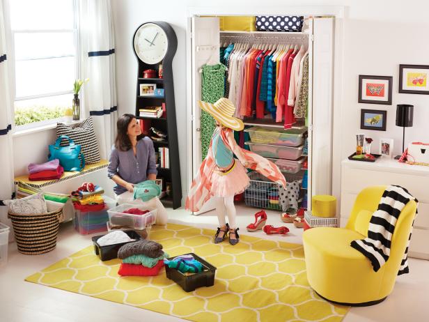 Girl's Closet in White Bedroom with Yellow Rug and Chair 