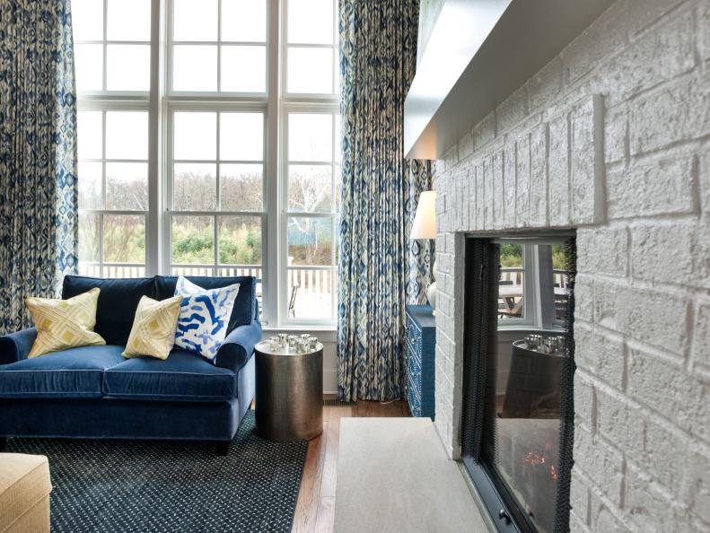 White Brick Fireplace and Blue Sofa from the 2014 HGTV Smart Home