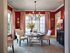 Red Dining Room With White Upholstered Chairs