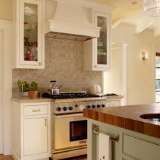 Cottage Kitchen With Gas Range and Butcher-Block Island