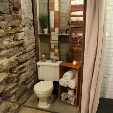 Eclectic Bathroom with Exposed Rock Wall