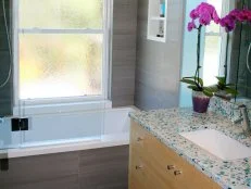 Blue Contemporary Bathroom With Gray Tile and Bamboo Vanity