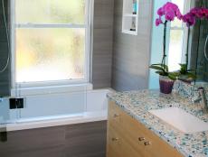 Using smart, eco-friendly materials and a fun, Caribbean color palette, designer Catherine Nakahara delighted her clients with this sleek, contemporary California guest bath, highlighting their all-time favorite color &ndash; blue!