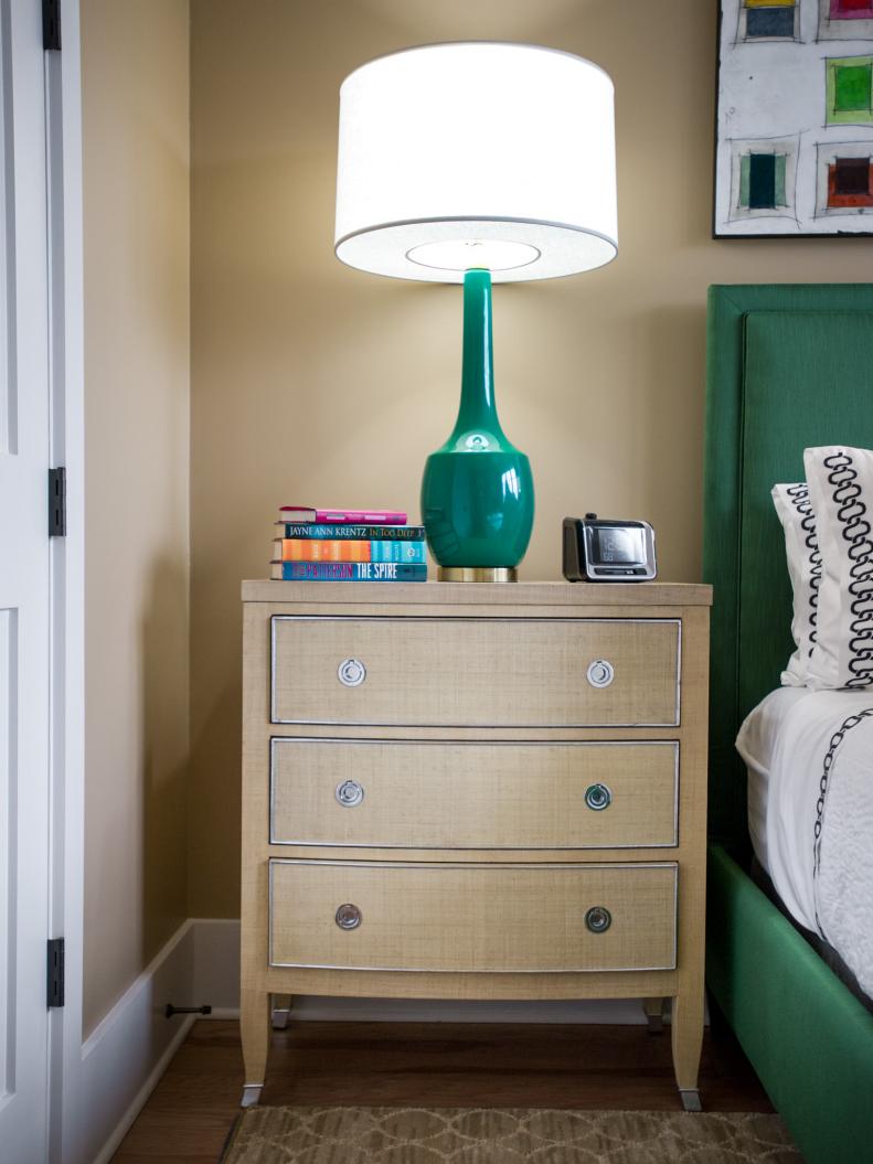Neutral Nightstand With Tall Emerald Green Lamp With White Shade
