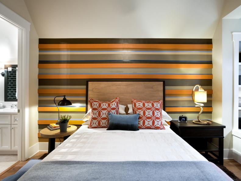 Neutral Transitional Bedroom With Striped Accent Wall