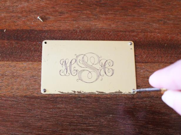 If the cutlery box had an existing brass plate, have it engraved with the jewelry box owner's initials then reattach. Tip: Trophy suppliers and jewelry stores offer engraving for a small fee.