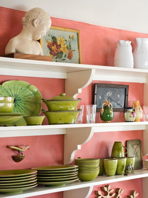 Open White Shelves With Green Dishes & Art in Pink Kitchen
