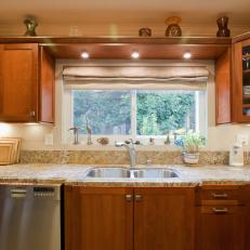 Neutral Kitchen With Wood Cabinets and Granite Counters