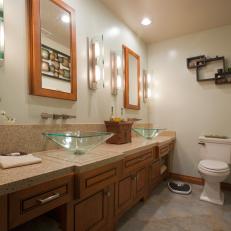 Art Deco-Inspired Bathroom with Green Glass Vessel Sinks
