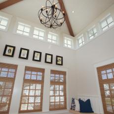 White Media Room With Vaulted Ceiling 