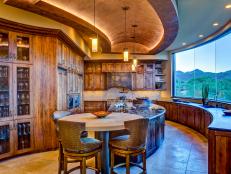 Southwestern Kitchen With Rustic Wood Cabinets and Large Windows