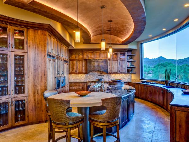 Southwestern Kitchen With Rustic Wood Cabinets and Large Windows