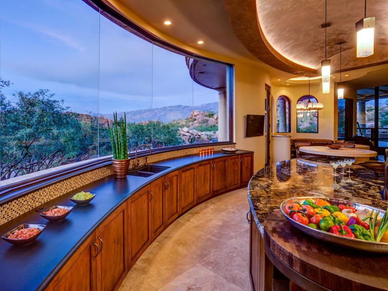 Modern Kitchen with Warm Tones and Sweeping Views 