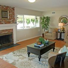 Neutral Traditional Living Room With Red Brick Fireplace