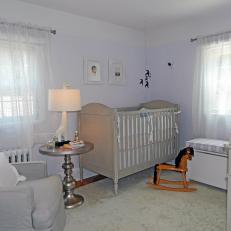 Pale Lavender Nursery With Gray Crib and Furniture