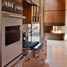 Neutral Modern Open Kitchen With Natural Wood Finishes and Granite Countertops
