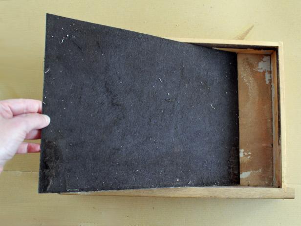 If your box has a bottom drawer, remove its felt linerbefore refinishing it but don't discard.