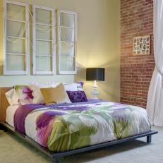 Bedroom with Platfrom Bed & Exposed Brick Walls