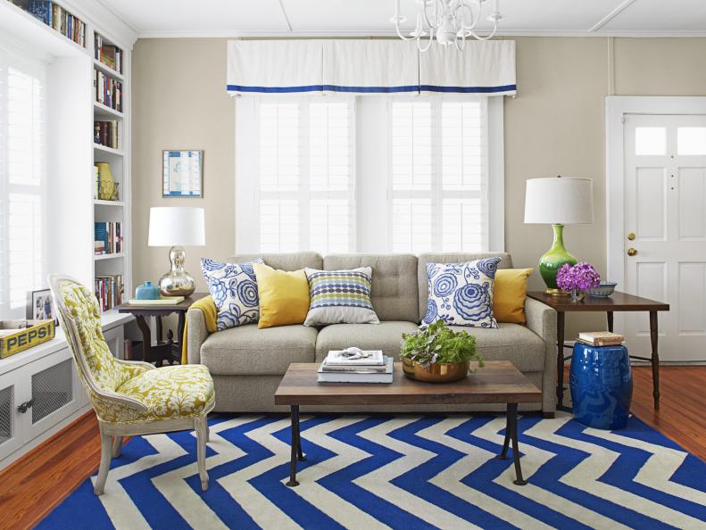 Living room with chevron rug, blues and yellows. 