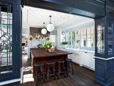 Navy blue and white kitchen with large island