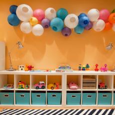 Wall Cubby Storage in Playroom With Paper Lanterns