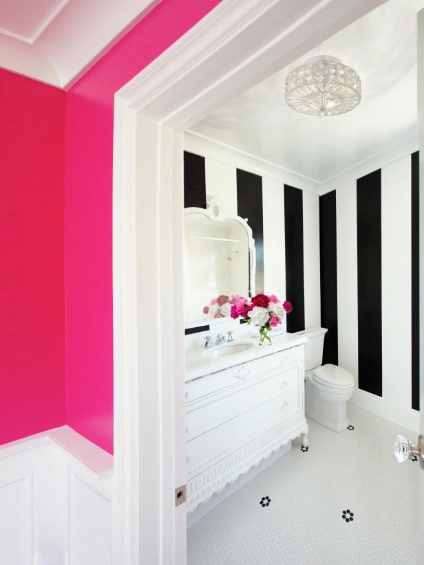 Black-and-white striped Hollywood regency-style bathroom