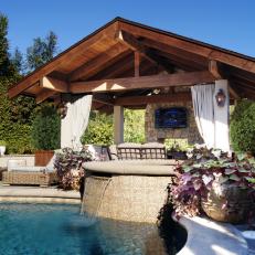 Wood-Beamed Cabana with Outdoor Fireplace